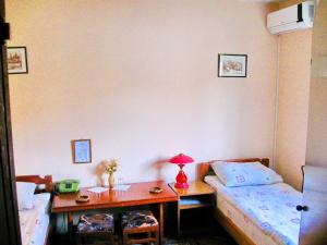 Rúm í herbergi á Amfora Rooms Caribrod