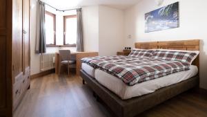 Postel nebo postele na pokoji v ubytování Hotel Compagnoni