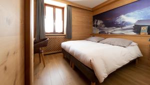 Postel nebo postele na pokoji v ubytování Hotel Compagnoni