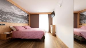 Postel nebo postele na pokoji v ubytování Hotel Compagnoni