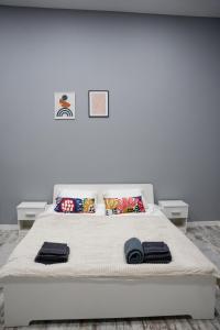 Posteľ alebo postele v izbe v ubytovaní Soho Apartments Lviv