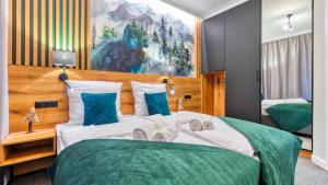 Posteľ alebo postele v izbe v ubytovaní Apartamenty VIP Centrum - Wczasowa 17 by Royal Aparts