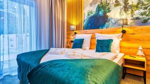 Posteľ alebo postele v izbe v ubytovaní Apartamenty VIP Centrum - Wczasowa 17 by Royal Aparts