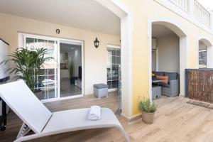 A seating area at Home2Book Palm Beach & Relax