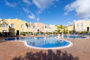 The swimming pool at or close to Home2Book Palm Beach & Relax