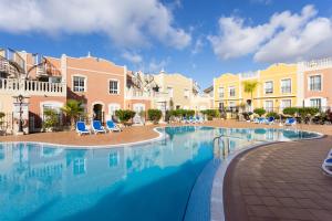 The swimming pool at or close to Home2Book Palm Beach & Relax