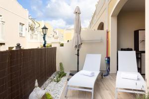 A balcony or terrace at Home2Book Palm Beach & Relax