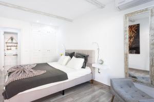 A bed or beds in a room at Home2Book Palm Beach & Relax