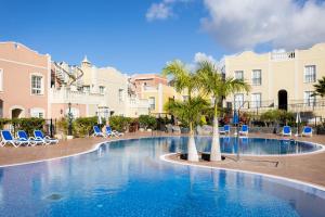 The swimming pool at or close to Home2Book Palm Beach & Relax
