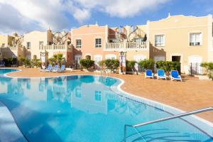 The swimming pool at or close to Home2Book Palm Beach & Relax