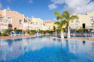 The swimming pool at or close to Home2Book Palm Beach & Relax