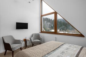 Postel nebo postele na pokoji v ubytování Tylko Tu i Teraz- Sauna, Balia z jacuzzi, Bon turystyczny