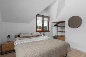 Postel nebo postele na pokoji v ubytování Tylko Tu i Teraz- Sauna, Balia z jacuzzi, Bon turystyczny