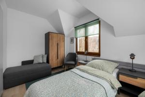 Postel nebo postele na pokoji v ubytování Tylko Tu i Teraz- Sauna, Balia z jacuzzi, Bon turystyczny