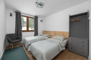 Postel nebo postele na pokoji v ubytování Tylko Tu i Teraz- Sauna, Balia z jacuzzi, Bon turystyczny