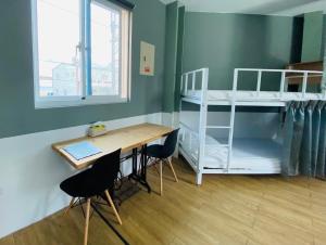 Łóżko lub łóżka w pokoju w obiekcie 太麻里金崙線織屋背包房Line Weaving House B&B