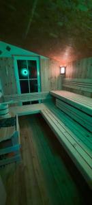 a room with benches in a room with a window at Rackhof in Oberlienz