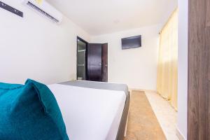 Llit o llits en una habitació de Ayenda Villa Marta
