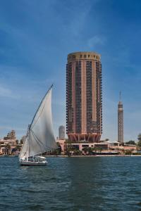 
a sailboat in the middle of a large body of water at Sofitel Cairo Nile El Gezirah in Cairo
