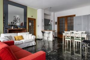 a living room with a white couch and a table at Boldrini apartment with balcony by Wonderful Italy in Bologna