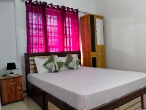 Postel nebo postele na pokoji v ubytování Bethel Service Villa, Mananthavady, Wayanad