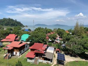an aerial view of a small village with red roofs at Pangkor Damai in Pangkor