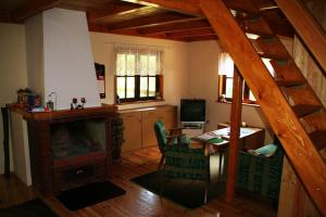 an overhead view of a living room with a fireplace at Summer House Stare Jabłonki in Stare Jabłonki