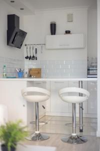 Kuchyňa alebo kuchynka v ubytovaní Rondo ONZ Business Apartment