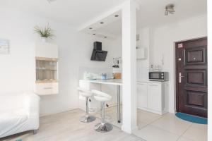 Kuchyňa alebo kuchynka v ubytovaní Rondo ONZ Business Apartment