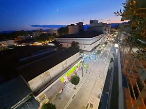 an overhead view of a city street at night at The Old Market House in Tríkala
