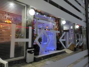 a window of a store with christmas lights at Hotel Lido in Athens
