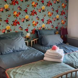 Кровать или кровати в номере Gite de la Sauvetat