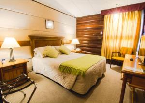Voodi või voodid majutusasutuse Panamericana Hotel Ancud toas