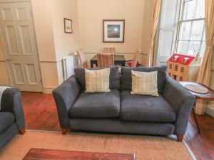 a living room with a couch and a table at Oakwood in Alnwick