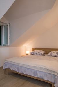 Postel nebo postele na pokoji v ubytování Apartment Ma_Lu