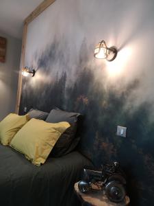 Postel nebo postele na pokoji v ubytování La Pause Ô Logis