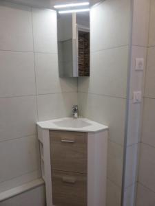 a bathroom with a sink and a mirror at ANGLET-BIARRITZ Studio vue Mer - Terrasse + Garage in Anglet