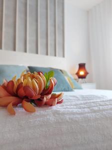 a flower on top of a bed at Duplex with sea views, garden and terrace in Santa Cruz de Tenerife