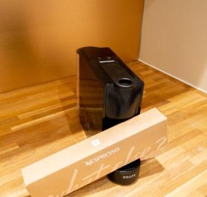 a coffee maker in a box on a floor at Salisbury Residence by Charles Hope in Salisbury
