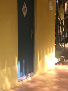a door with a dont sign on the side of a building at studio Sainte Anne 2mn a pieds de la plage in Sainte-Anne