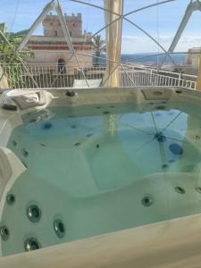 a hot tub on the deck of a boat at Villa Cesarea Dimora di Charme in Santa Cesarea Terme