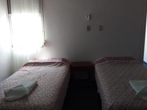 Voodi või voodid majutusasutuse Hotel Escorial toas