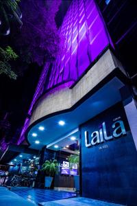 a building with a sign in front of it at night at LaiLa Hotel CDMX Reforma in Mexico City