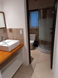 Et badeværelse på Cabaña La Joaquina - Villa Giardino