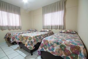 מיטה או מיטות בחדר ב-Apartamento Climatizado em Natal por Carpediem
