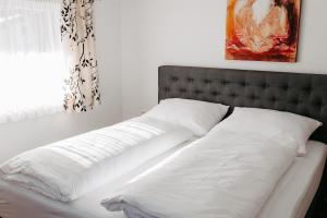 Een bed of bedden in een kamer bij Apartment Maria