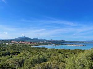a view of a lake with boats in the water at Casa Leo - Villaggio Baia De Bahas in Golfo Aranci