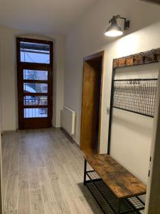 a room with a bench in front of a door at Apartmán na náměstí in Králíky