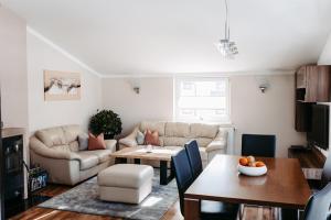 a living room with a couch and a table at Apartment Maria in Schlitters