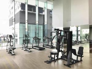 a gym with several tread machines in a building at Setia Sky 88 Living in the Skies in Johor Bahru